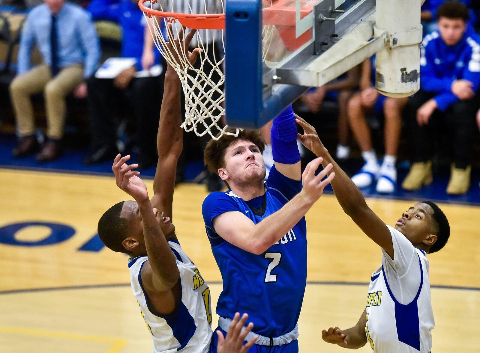 Hamilton’s Kurtis Reid eyes the basket in traffic Friday night during a 58-52 victory at Northwest. NICK GRAHAM/STAFF