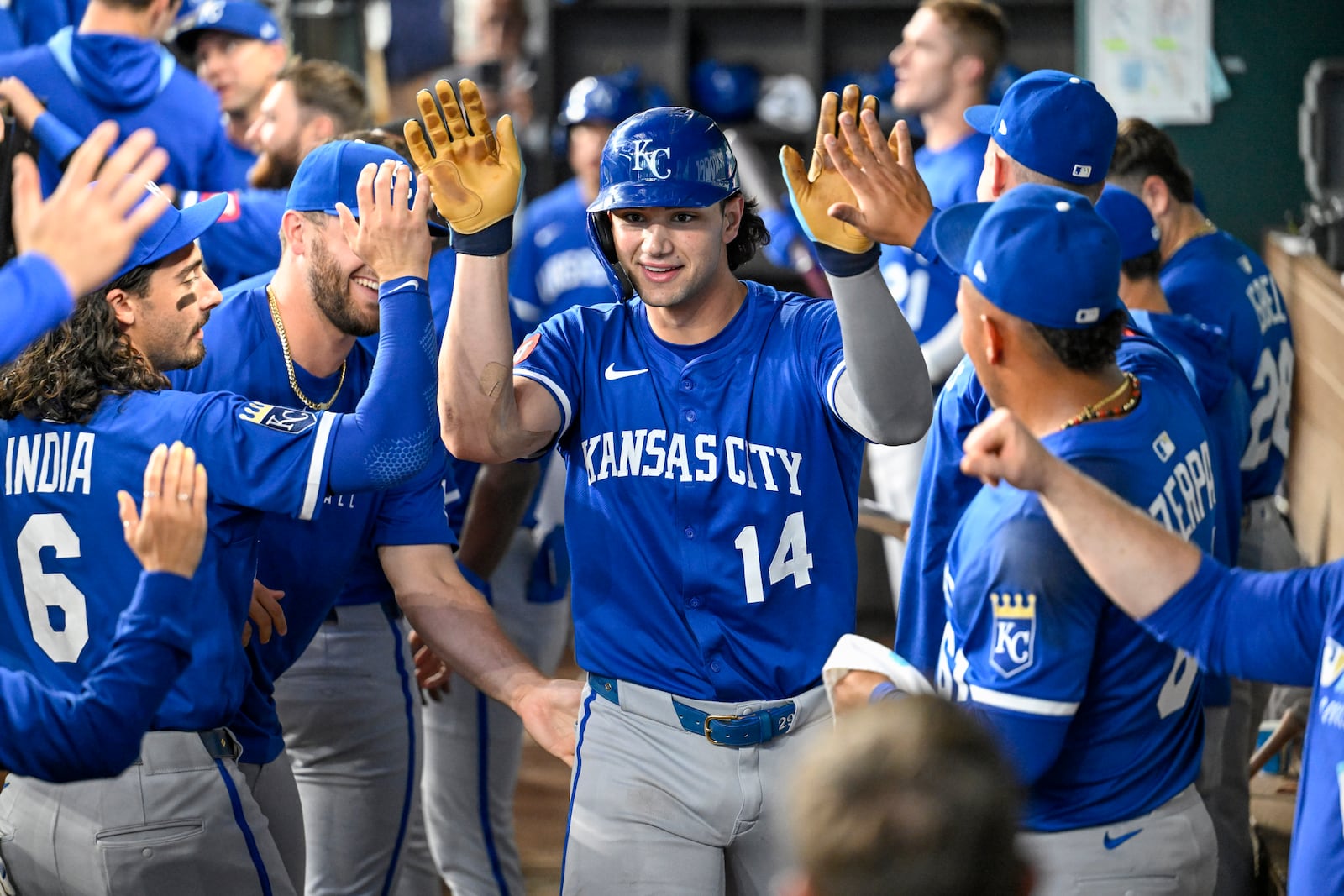 Kansas City Royals' Jac Caglianone celebrates in the dugout after hitting his second home run of the game, and the second of his career, in the dugout in the ninth inning during a baseball game against the Texas Rangers, Thursday, June 19, 2025, Arlington, Texas. (AP Photo/Albert Pena)