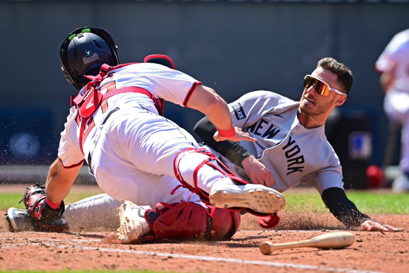 Cleveland Guardians catcher Austin Hedges tags out New York Yankees' Cody Bellinger at home during the sixth inning of a baseball game, Wednesday, April 23, 2025, in Cleveland. (AP Photo/David Dermer)