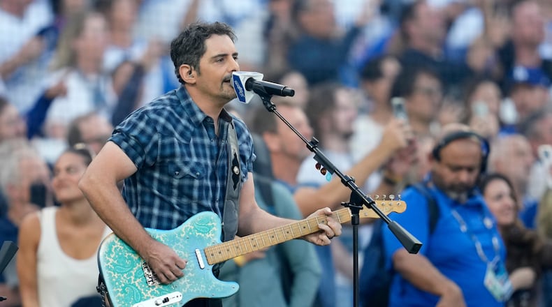 Recording artist Brad Paisley perform the national anthem prior to Game 3 of baseball's World Series between the Toronto Blue Jays and the Los Angeles Dodgers, Monday, Oct. 27, 2025, in Los Angeles. (AP Photo/Ashley Landis)