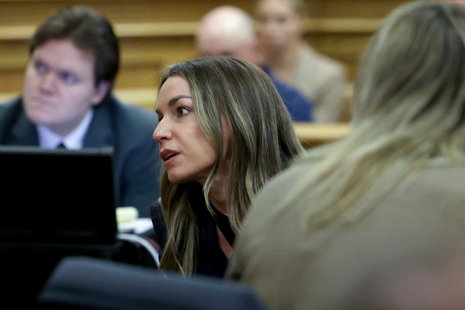 Karen Read gets the attention of her lawyer during the Karen Read murder trial in Norfolk Superior Court in Dedham, Mass., Friday, May 9, 2025. (Mark Stockwell/The Sun Chronicle via AP, Pool)