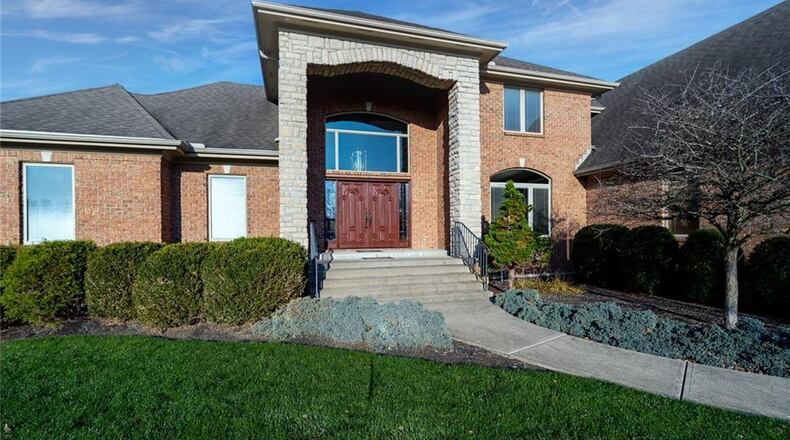 Listed for $799,900 by Austin and Anna Castro of Coldwell Banker Heritage, the brick house at 2461 Quorn Court has about 7,215 square feet of living space in the Hunt Club gated community of Washington Twp. The house sits on a 1.34-acre lot within a cul-de-sac setting. A wrought-iron fence surrounds much of the back yard, and a concrete driveway has extra parking near the three-car, side-entry garage. Find other listed homes in the Dayton Daily News’ HomesPlus. PHOTOS COURTESY OF DAYTON REALTORS.
