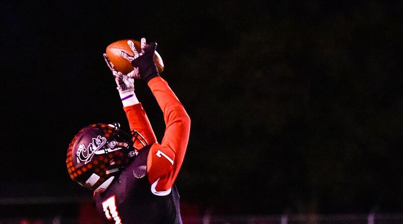 Franklin’s Jared Kinzer makes a leaping catch and carries the ball into the end zone for a touchdown during an Oct. 26 game against Brookville at Atrium Stadium in Franklin. The host Wildcats won 24-21. NICK GRAHAM/STAFF