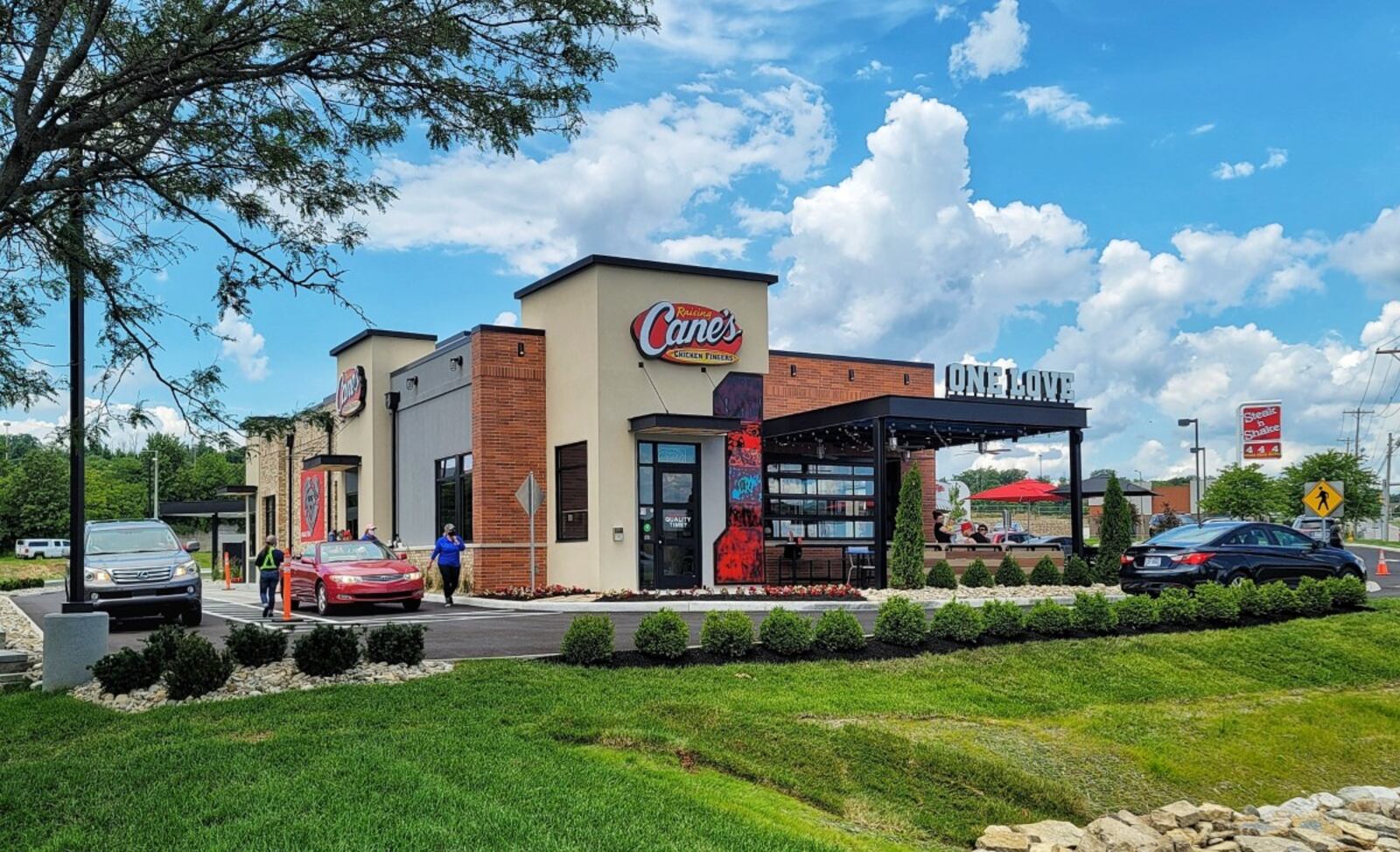 The new Raising Cane’s chicken finger chain location is now open on Main Street in Hamilton. The restaurant held a ribbon cutting ceremony June 29, 2021 to celebrate the debut at 1479 Main St. in Hamilton. NICK GRAHAM / STAFF