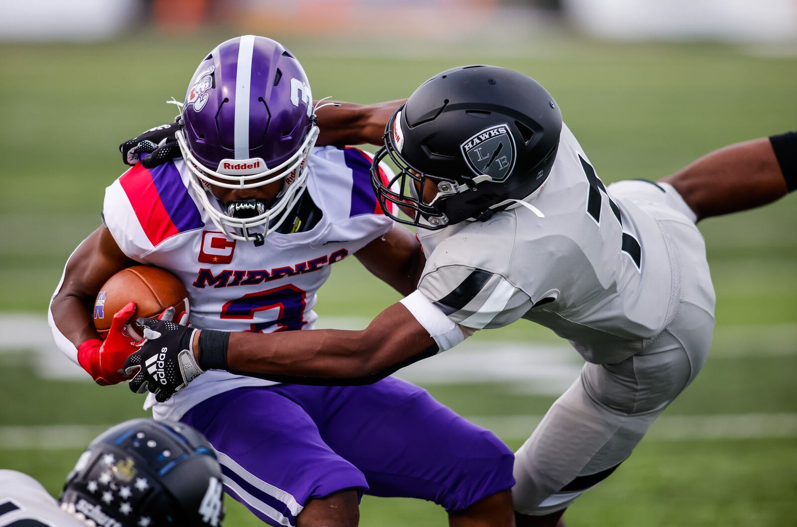 Lakota East defensive back Justin Green (7) tries to tackle Middletown running back Jaylon Dillard (3) during their football game Friday, Sept. 3, 2021 at Lakota East High School in Liberty Township. Lakota East won 49-7. NICK GRAHAM / STAFF