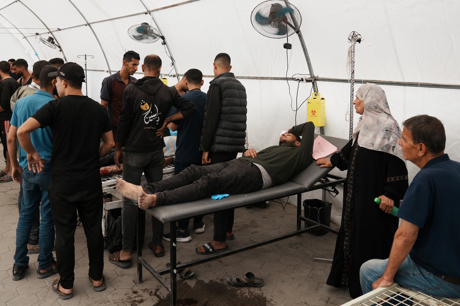 Palestinians lie on stretchers at the Baptist Hospital after being injured in an Israeli airstrike in Gaza City, Friday, May 30, 2025. (AP Photo/Jehad Alshrafi)