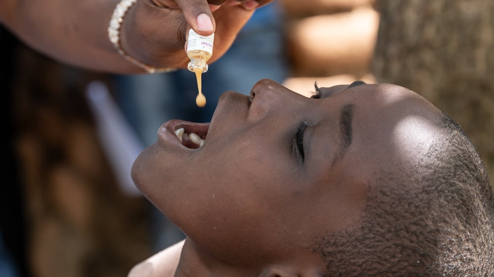 A health worker administers a cholera vaccine in Blantyre, southern Malawi, Thursday, Jan. 22, 2026. (AP Photo/Thoko Chikondi)