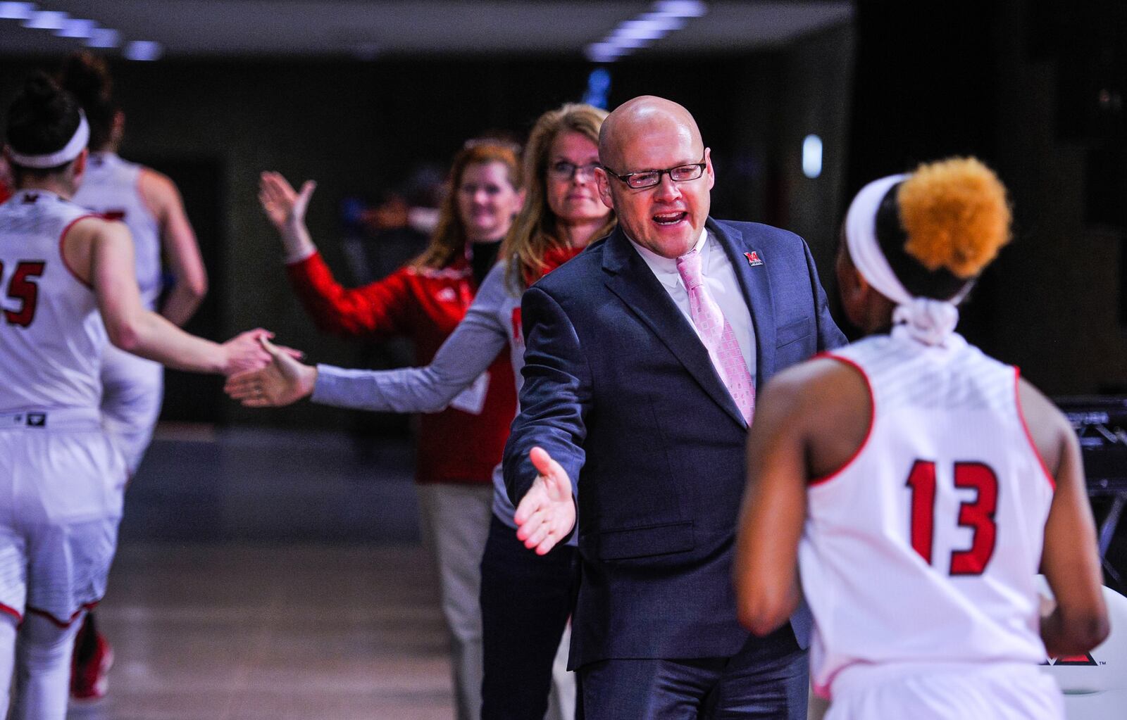 Miami University president Greg Crawford shows his spirit at Thursday night’s WNIT loss to Duquesne at Millett Hall in Oxford. NICK GRAHAM/STAFF