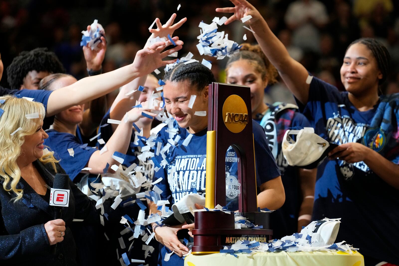 UConn players shower guard Azzi Fudd (35) with confetti after defeating South Carolina in the national championship game at the Final Four of the women's NCAA college basketball tournament, Sunday, April 6, 2025, in Tampa, Fla. (AP Photo/Chris O'Meara)