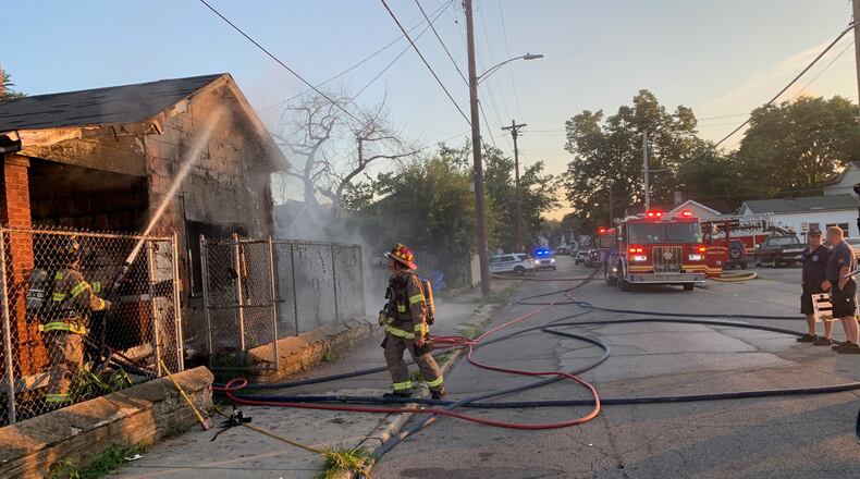 A woman was trapped inside this burning Middletown residence on July 26 and she was carried to safety by two Middletown police officers. MIDDLETOWN DIVISION OF FIRE