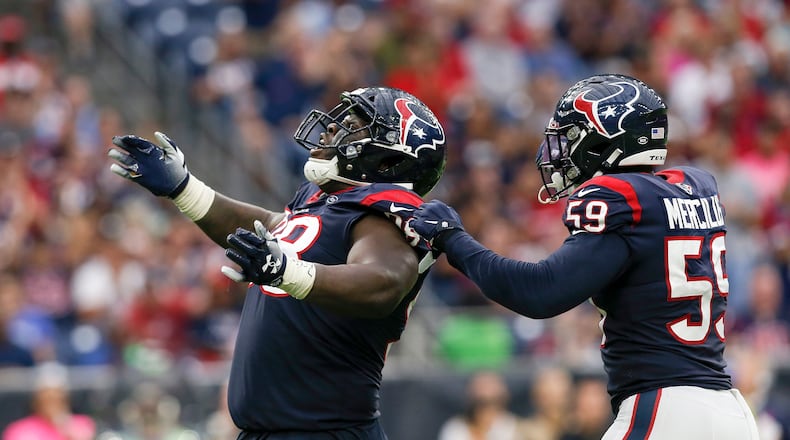 HOUSTON, TX - OCTOBER 06: D.J. Reader #98 of the Houston Texans celebrates with Whitney Mercilus #59 after a sack in the second half against the Atlanta Falcons at NRG Stadium on October 6, 2019 in Houston, Texas. (Photo by Tim Warner/Getty Images)