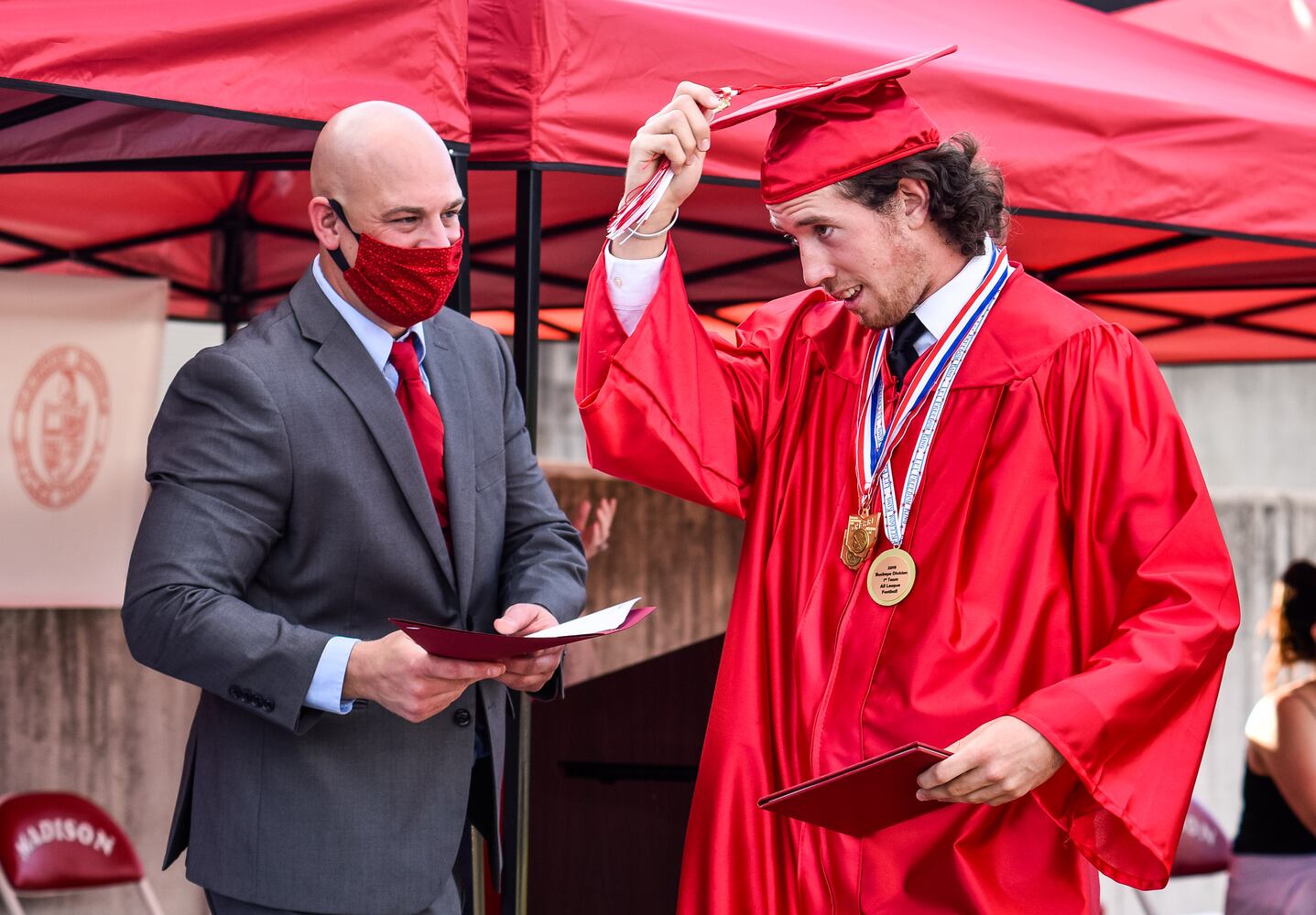 Madison High School drive-thru graduation ceremony at Land of Illusion
