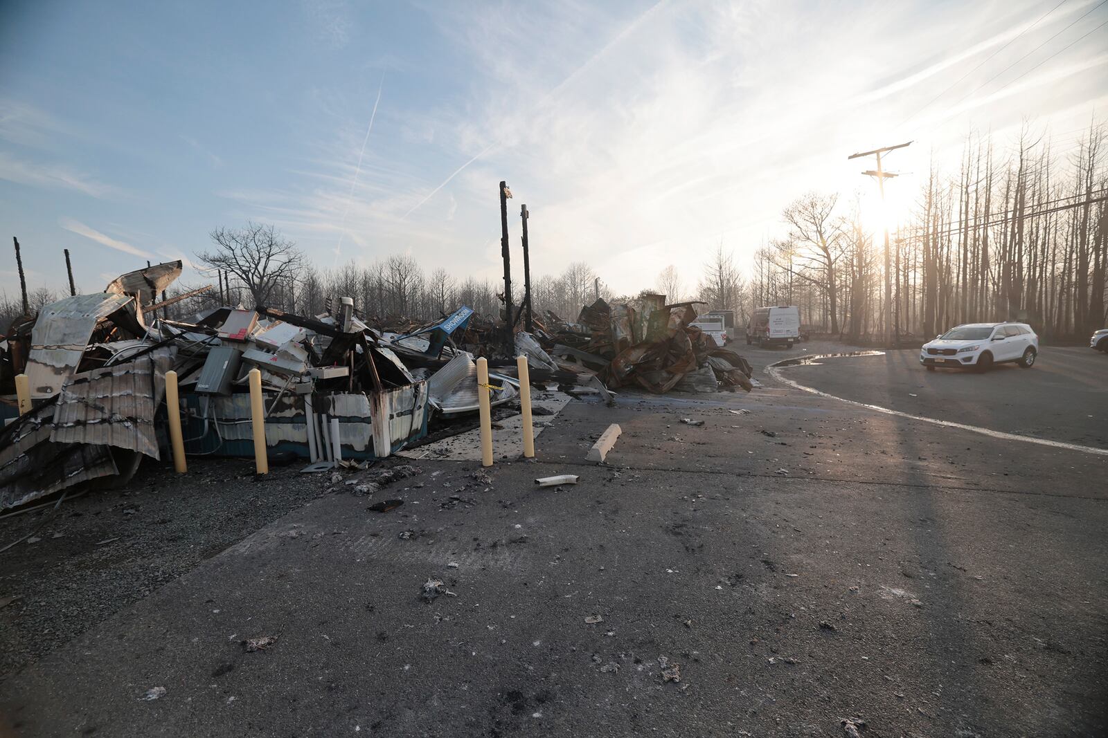 Liberty Door and Awning's 20,000 foot warehouse is damaged from a wildfire in Forked River, N.J., on Wednesday, April 23, 2025. (Elizabeth Robertson /The Philadelphia Inquirer via AP)