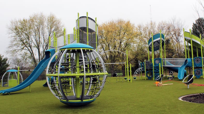 Situated on artificial turf, the 70-foot by 200-foot playground area in Harbin Park in Fairfield sits adjacent to a new splash pad expected to open next spring after several delays in getting permits from the Ohio Department of Health. The playground features two separate areas — one with equipment targeted for children ages 6-12; the second aimed at 2- to 5-year-olds. This is the one for 6-12 year-olds. CONTRIBUTED