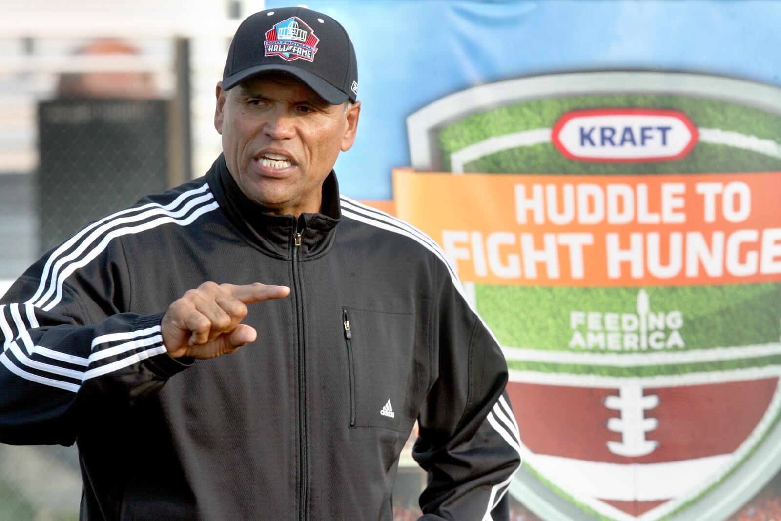 Former Cincinnati football great Anthony Munoz attended a special youth football clinic at Lakota West High School, Wednesday, Sept. 28, 2011. Munoz, who was promoting Kraft Foods' ambitious Huddle to Fight Hunger campaign during Hunger Action Month, talked to the athletes watched over a Lakota Tomahawk youth football practice. Staff photo by Greg Lynch