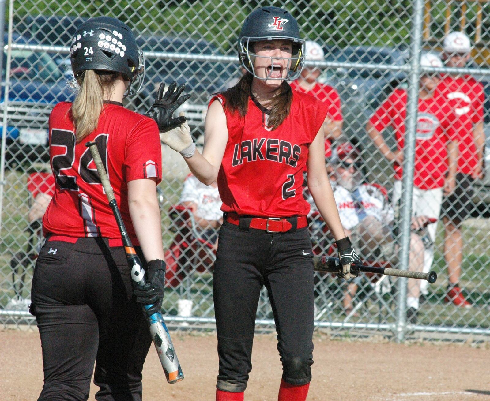 Indian Lake’s Kassidy Crockett (2) lets out a yell after scoring a run Wednesday during a Division III sectional softball game at Carlisle. The host Indians won 2-1. RICK CASSANO/STAFF