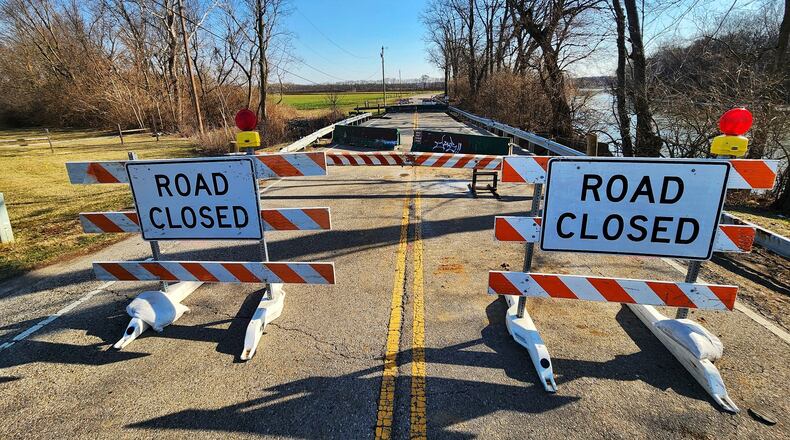 Franklin Trenton Road is closed after a section of bridged crumbled into creek bed below between Hobart Avenue and Water Source Drive in Franklin Township. NICK GRAHAM/STAFF