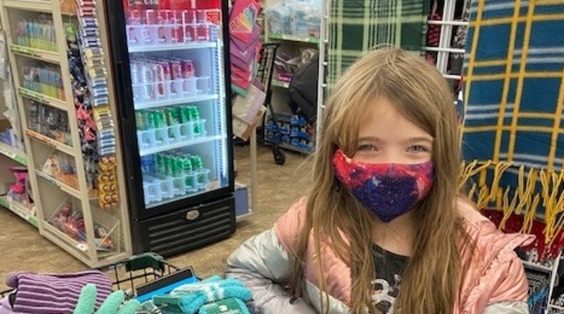 Lilyann Robinson spent $75 she received for her eighth birthday to purchase gloves, hats and scarves for residents of Hope House, a homeless shelter in Middletown. She is a second-grader at Madison Elementary School and the International United Miss Ohio Jr. Preteen. Because of her community service, Lilyann has been recognized as an “Upstander” by the Holocaust and Humanity Center in Cincinnati. SUBMITTED PHOTO