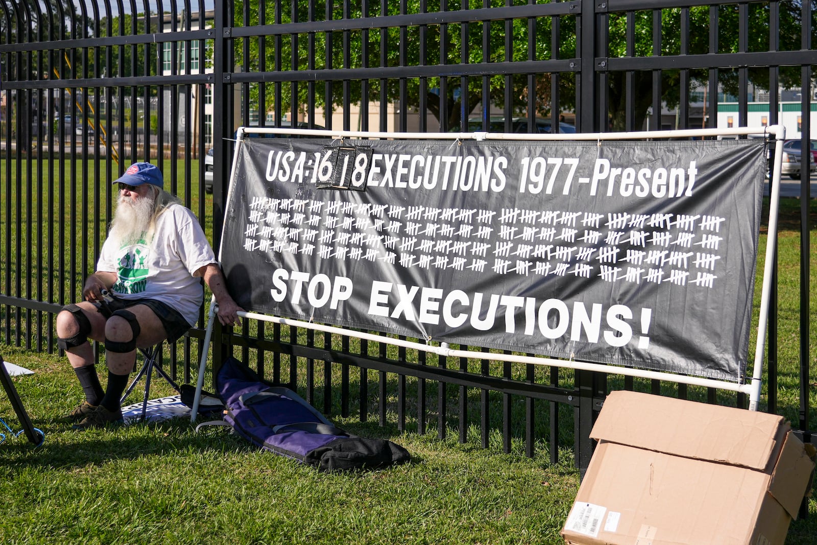 Ron Kaz demonstrates outside the site of the scheduled execution of South Carolina inmate Mikal Mahdi in Columbia, S.C., Friday, April 11, 2025. (AP Photo/David Yeazell)