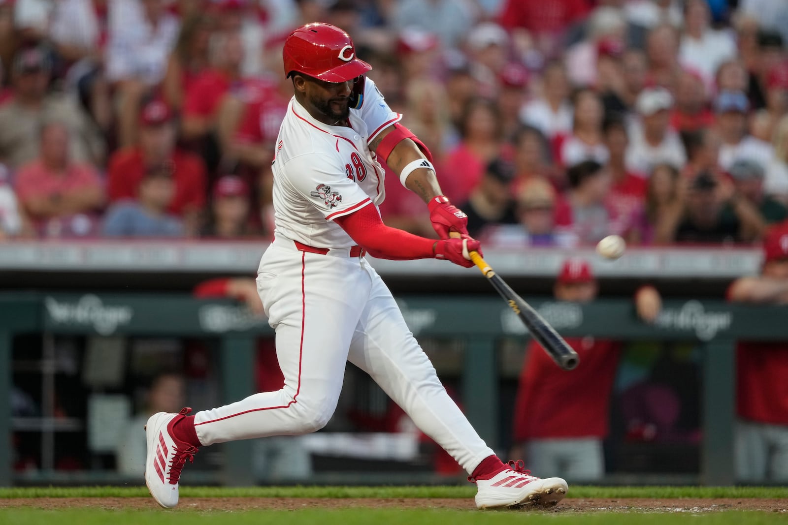 Cincinnati Reds' Miguel Andujar hits a grand slam home run during the seventh inning of a baseball game against the Philadelphia Phillies Wednesday, Aug. 13, 2025, in Cincinnati. (AP Photo/Carolyn Kaster)