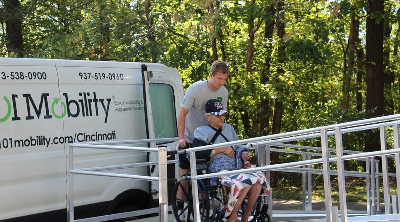 Operation Ramp It Up recently had student volunteers, with the assistance of 101 Mobility in Blue Ash, install an aluminum ramp for a Vietnam veteran in Fairfield. Pictured is One photo is Badin High School senior Asher Cook wheeling William Wiggs into his camper on Oct. 4, 2024, when the ramp was installed. PROVIDED