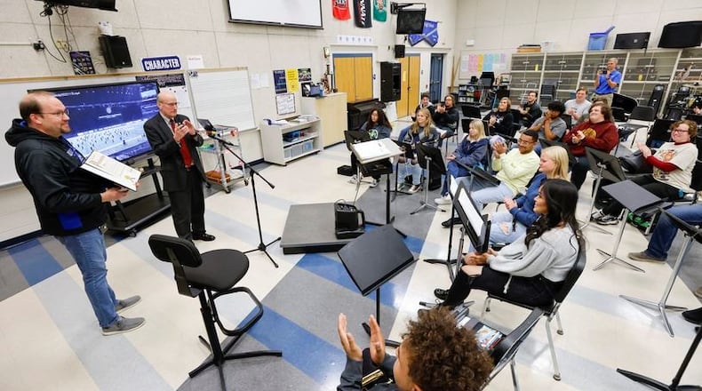 Hamilton Schools’ growing reputation for musical excellence just got a national boost. The city schools’ various music programs throughout the 9,000-student district were recently honored with its first Best Communities for Music Education award. In November, Hamilton Mayor Pat Moeller visited the high school's band program to deliver a city proclamation honoring the marching band for a recent, top band competition win. (Photo By Nick Graham\Journal-News)