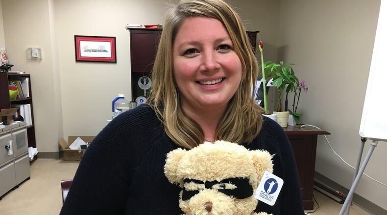 Lauren Matus, development officer at the Middletown Community Foundation, said “Ready Teddy” bears can be used to “start talking about the bigger issues” surrounding early childhood development. RICK McCRABB/STAFF