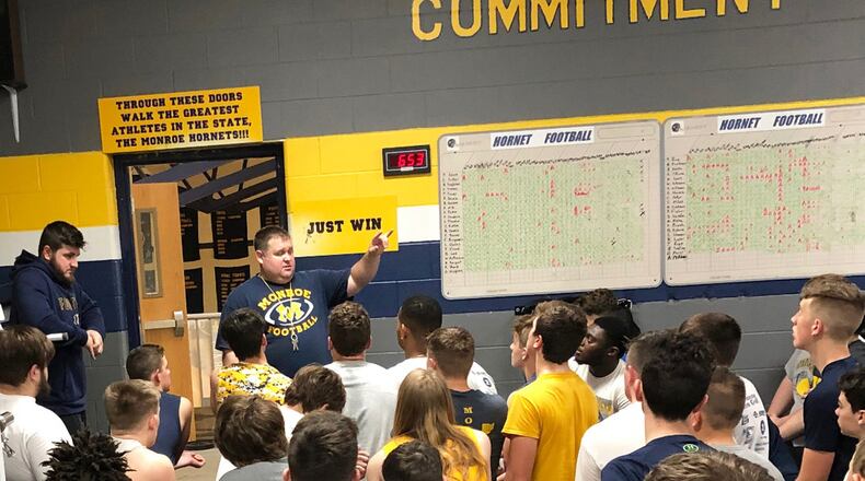 New Monroe High School football coach Bob Mullins talks to his team during a recent workout session at the school. SUBMITTED PHOTO