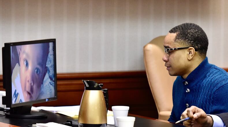 Less than 24 hours after finding Michael Grevious II guilty of aggravated murder, the jury returned to the courtroom for the sentencing phase of the trial. Grevious began crying in court today while looking at a photo of his young son. NICK GRAHAM/STAFF