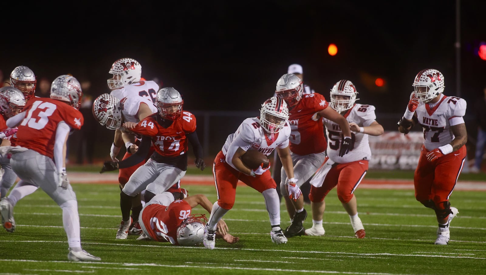 Wayne's Isaiah Thompson runs against Troy in a Division I, Region 2 semifinal on Friday, Nov. 14, 2025, at Troy Memorial Stadium. David Jablonski/Staff