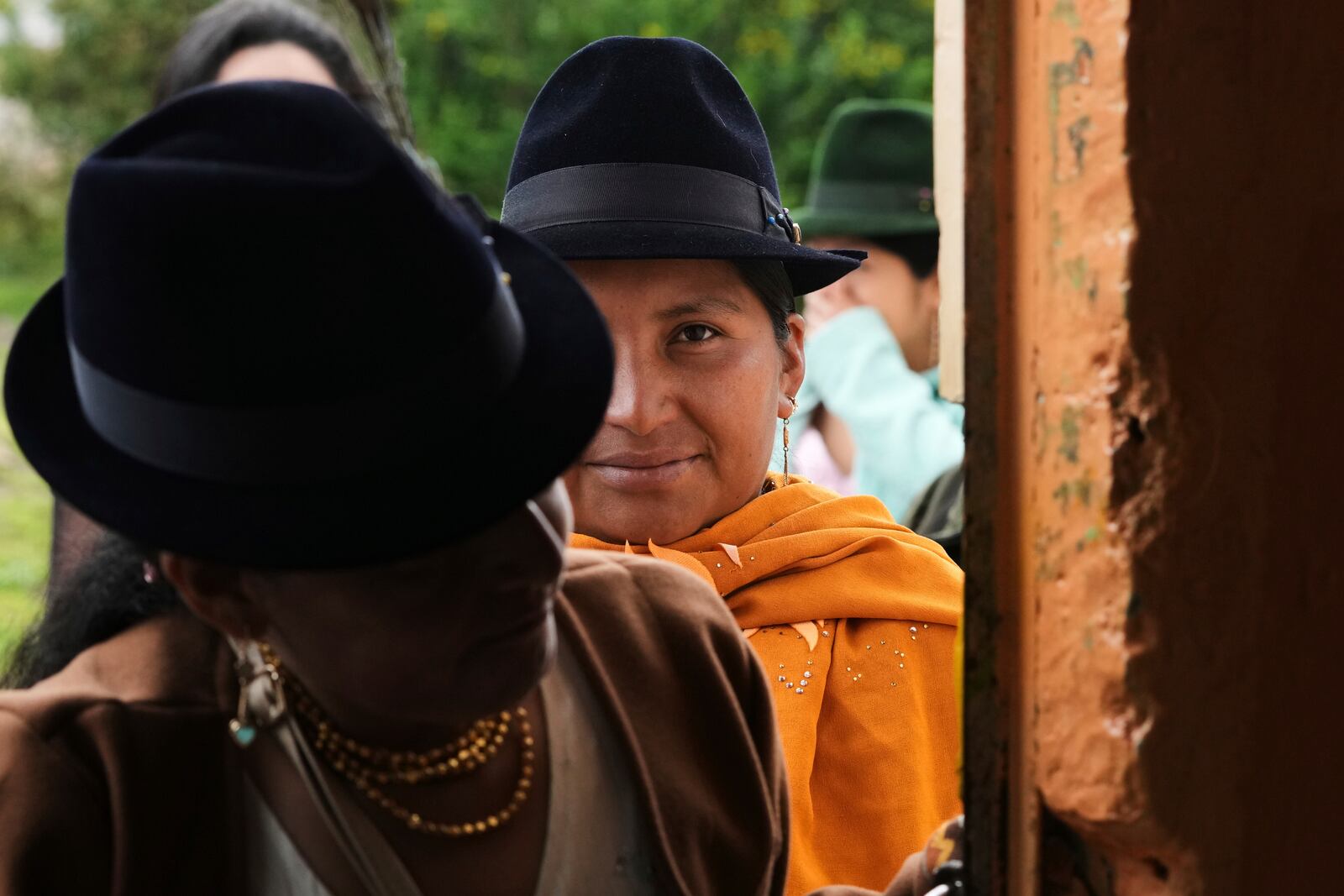 Women line up to vote during the presidential election runoff in Pujili, Ecuador, Sunday, April 13, 2025. (AP Photo/Dolores Ochoa)