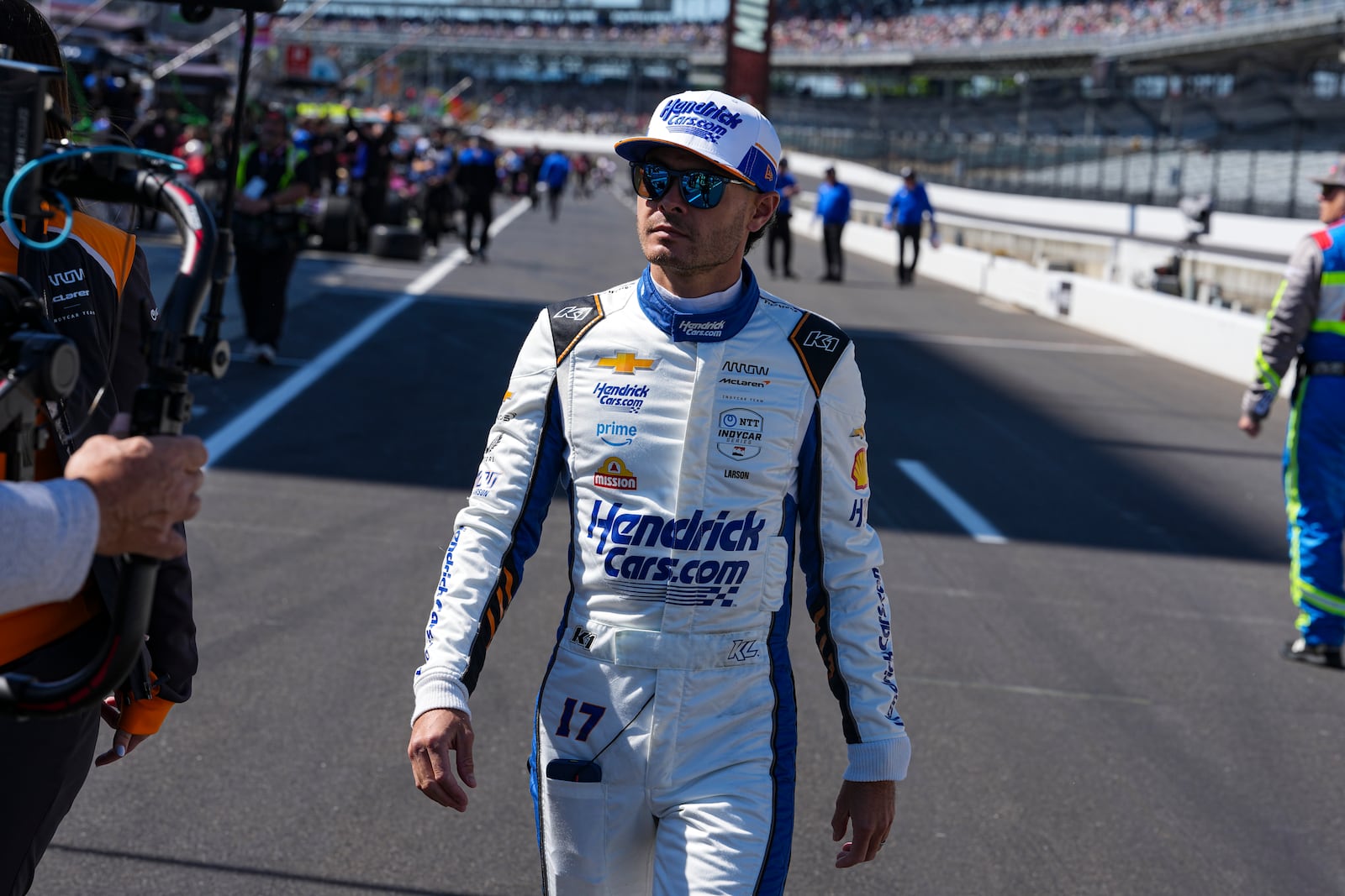 Kyle Larson walks to his car before the start practice for the Indianapolis 500 auto race at Indianapolis Motor Speedway in Indianapolis, Friday, May 23, 2025. (AP Photo/Michael Conroy)