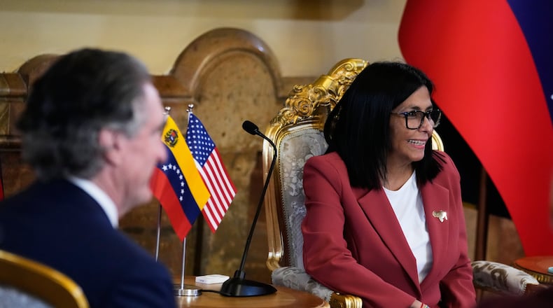 Venezuela's acting President Delcy Rodriguez, right, and U.S. Interior Secretary Doug Burgum meet at Miraflores presidential palace in Caracas, Venezuela, Wednesday, March 4, 2026. (AP Photo/Ariana Cubillos)