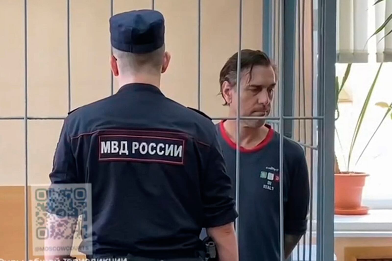 FILE - In this photo taken from video released by Khamovnichesky District Court press service on July 18, 2024, U.S. citizen Michael Travis Leake stands in a cage in a courtroom in the Khamovnichesky District Court, in Moscow, before being convicted of drug trafficking charges and sentenced to 13 years in prison. (Khamovnichesky District Court via AP, File)