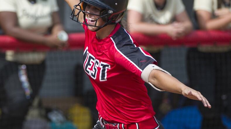 Lakota West’s Allie Cummins rounds third base after her eighth-inning home run in Thursday afternoon’s Division I state semifinal against Perrysburg at Firestone Park in Akron. Cummins and the Firebirds won 2-1. PHIL LONG/OHIO PRESS PHOTO SYSTEM
