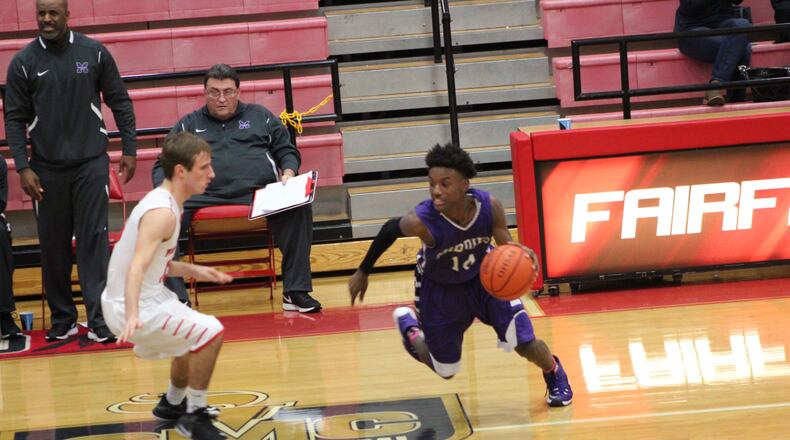 Middletown’s Aaron Jones (14), shown driving against Fairfield’s Kyle Schimpf last season, scored 10 points in Friday night’s 56-47 season-opening win over visiting Kings. CONTRIBUTED PHOTO BY MARITZA MCKINNEY