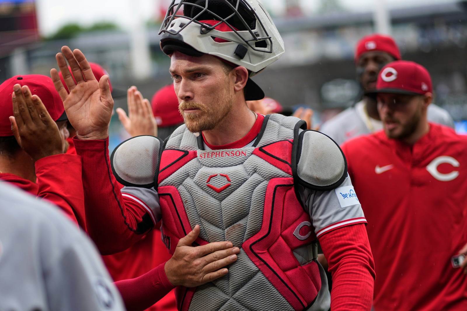 Cincinnati Reds' Will Benson celebrates with teammates after their baseball game against the Kansas City Royals, Monday, May 26, 2025, in Kansas City, Mo. (AP Photo/Charlie Riedel)