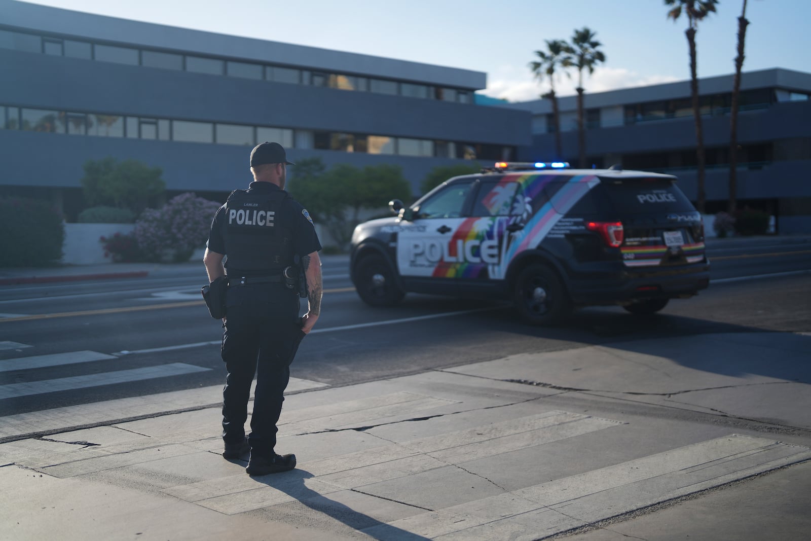 A police officer stands guard at a check point near the site of an explosion in Palm Springs, Calif., on Saturday, May 17, 2025. (AP Photo/Eric Thayer)