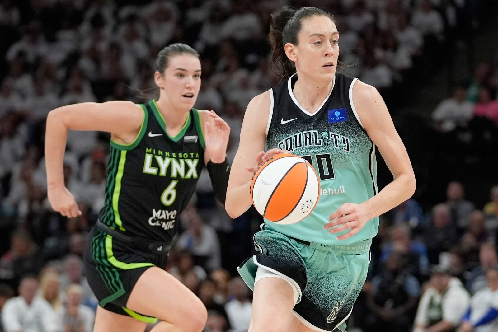 FILE - New York Liberty forward Breanna Stewart drives to the basket past Minnesota Lynx forward Bridget Carleton (6) during the first half of Game 4 of a WNBA basketball final playoff series, Friday, Oct. 18, 2024, in Minneapolis. (AP Photo/Abbie Parr, File)