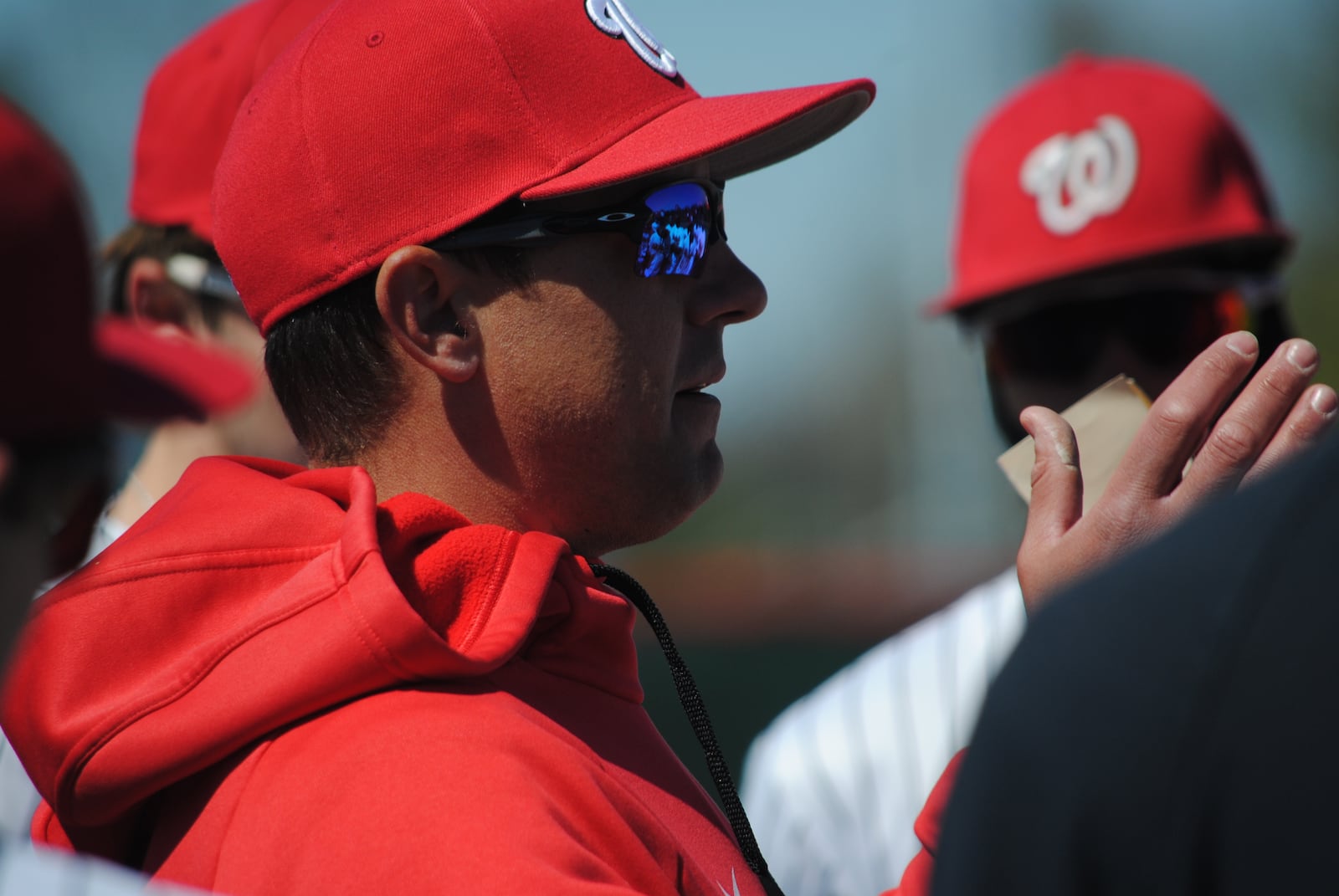 Lakota West baseball coach Brad Gschwind talks to his players after the Firebirds' 3-0 victory over Milford on Saturday. CHRIS VOGT / CONTRIBUTED
