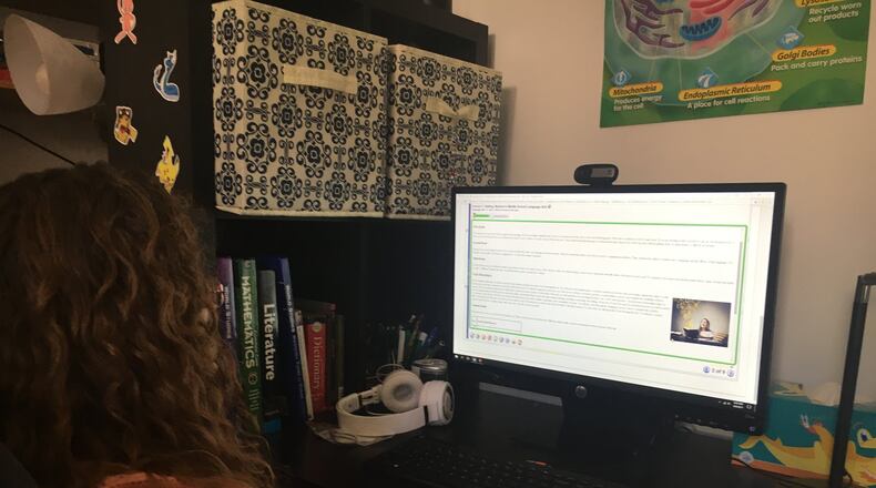 Hundreds of students in the Dayton area have attended online school in recent years, completing assignments on their computers at home. JEREMY P. KELLEY / STAFF