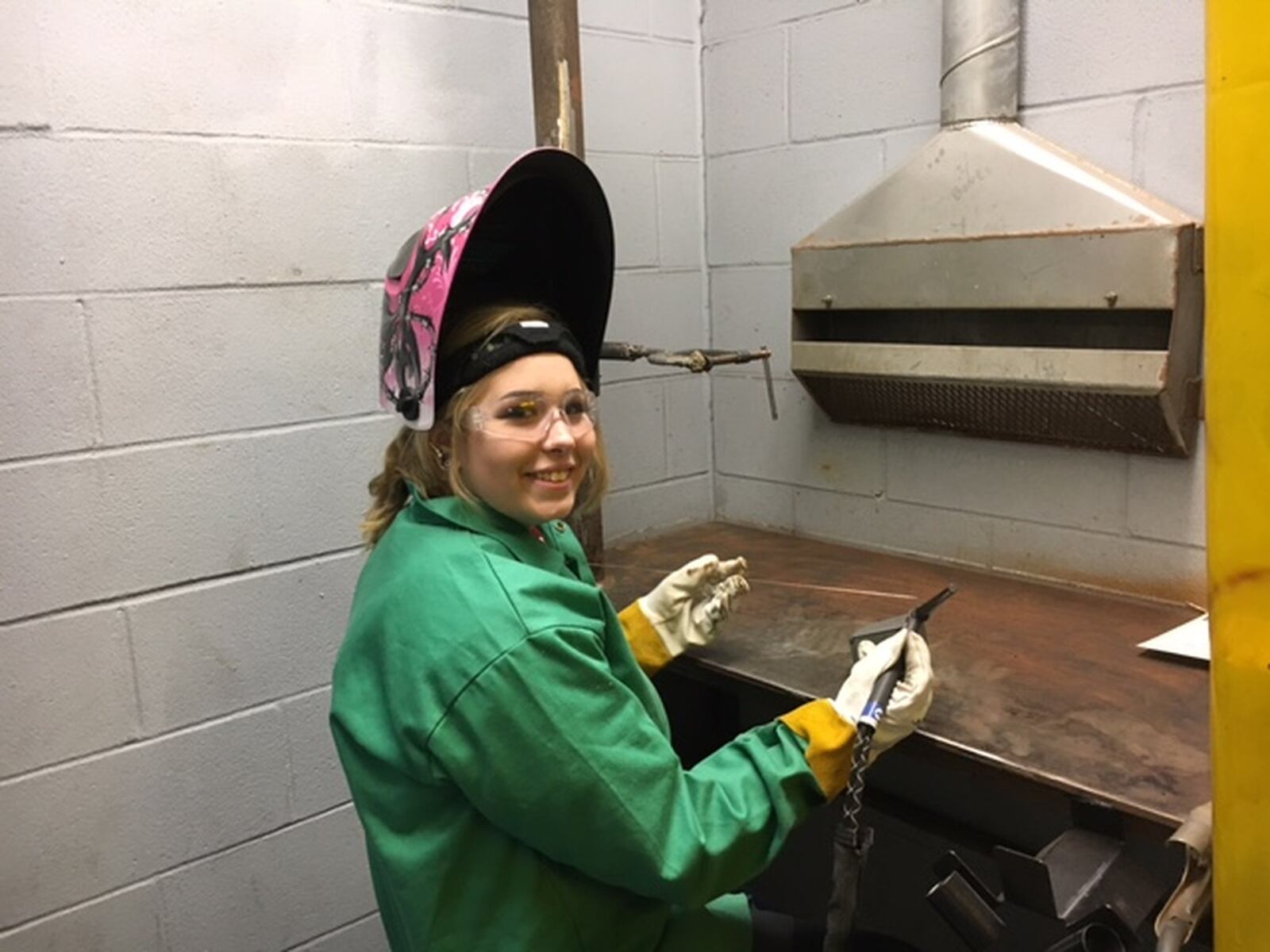 Drew Hereld, 17, an Upper Valley Career Center student, as she prepared to weld last November at a Sheet Metal Workers Local 24 workshop in Dayton. Manufacturers today are working to find and train young people in both skilled trades and advanced manufacturing. THOMAS GNAU/STAFF