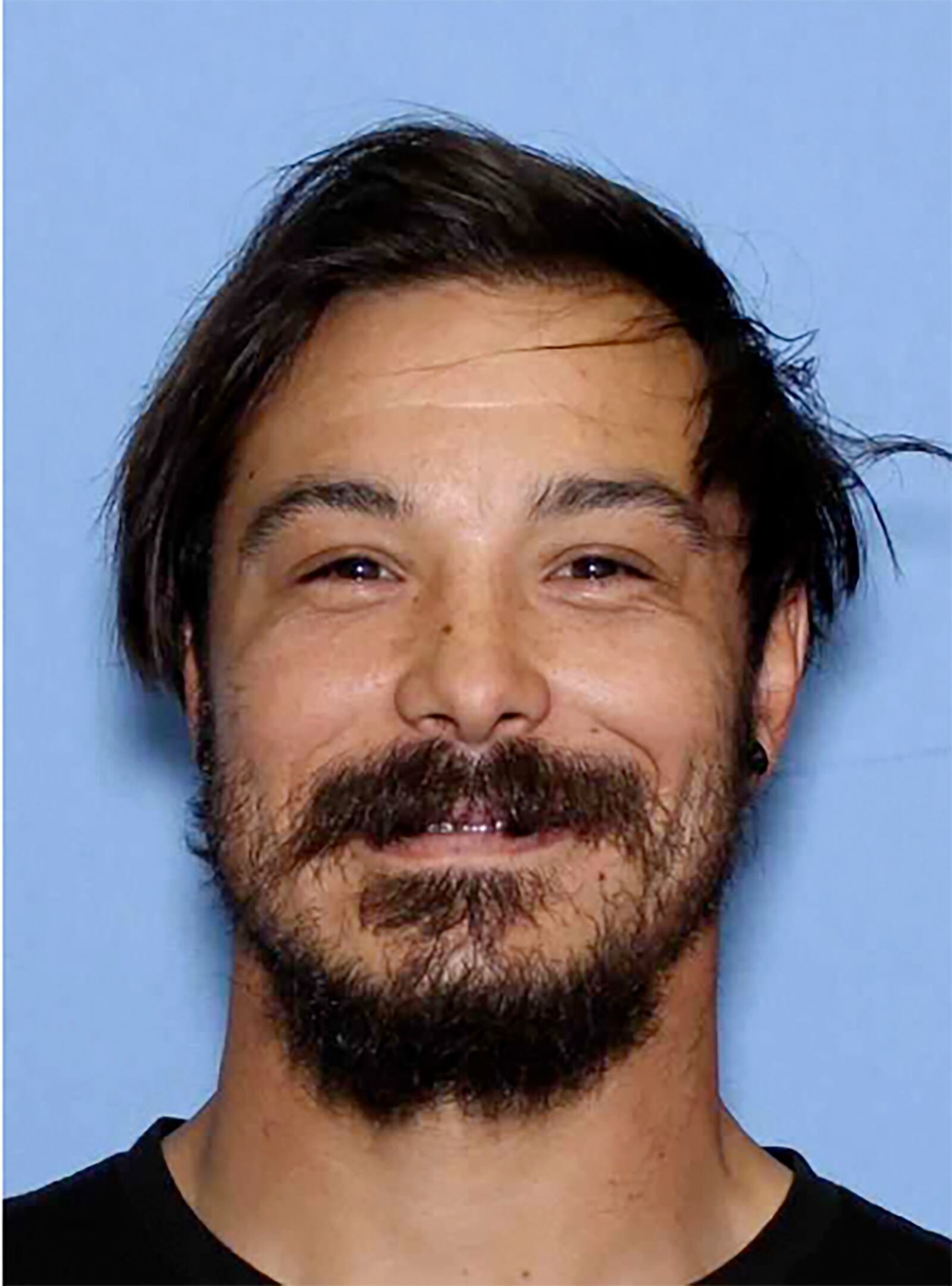 This undated photo provided by the Wenatchee Police Department shows Travis Caleb Decker who the police are asking the public for help in locating the Washington state father who is wanted for murder after his three young daughters were reported missing and then found dead. (Wenatchee Police Department via AP)