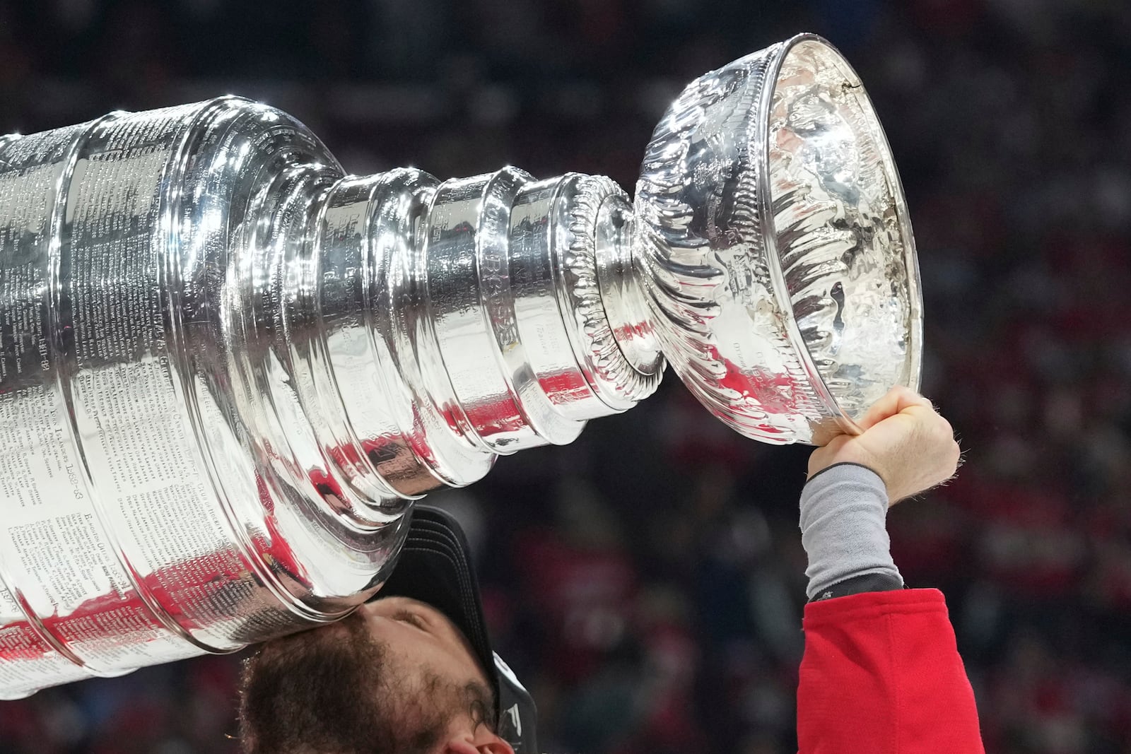 FILE - Florida Panthers center Sam Reinhart (13) kisses the Stanley Cup after defeating the Edmonton Oilers in Game 6 of the NHL hockey Stanley Cup Final Tuesday, June 17, 2025, in Sunrise, Fla. (AP Photo/Lynne Sladky, File)
