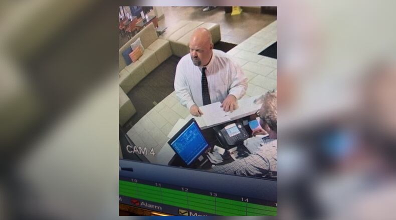 Photos exclusively obtained by News Center 7 show Justin Smith checking into a Lexington, Kentucky hotel.