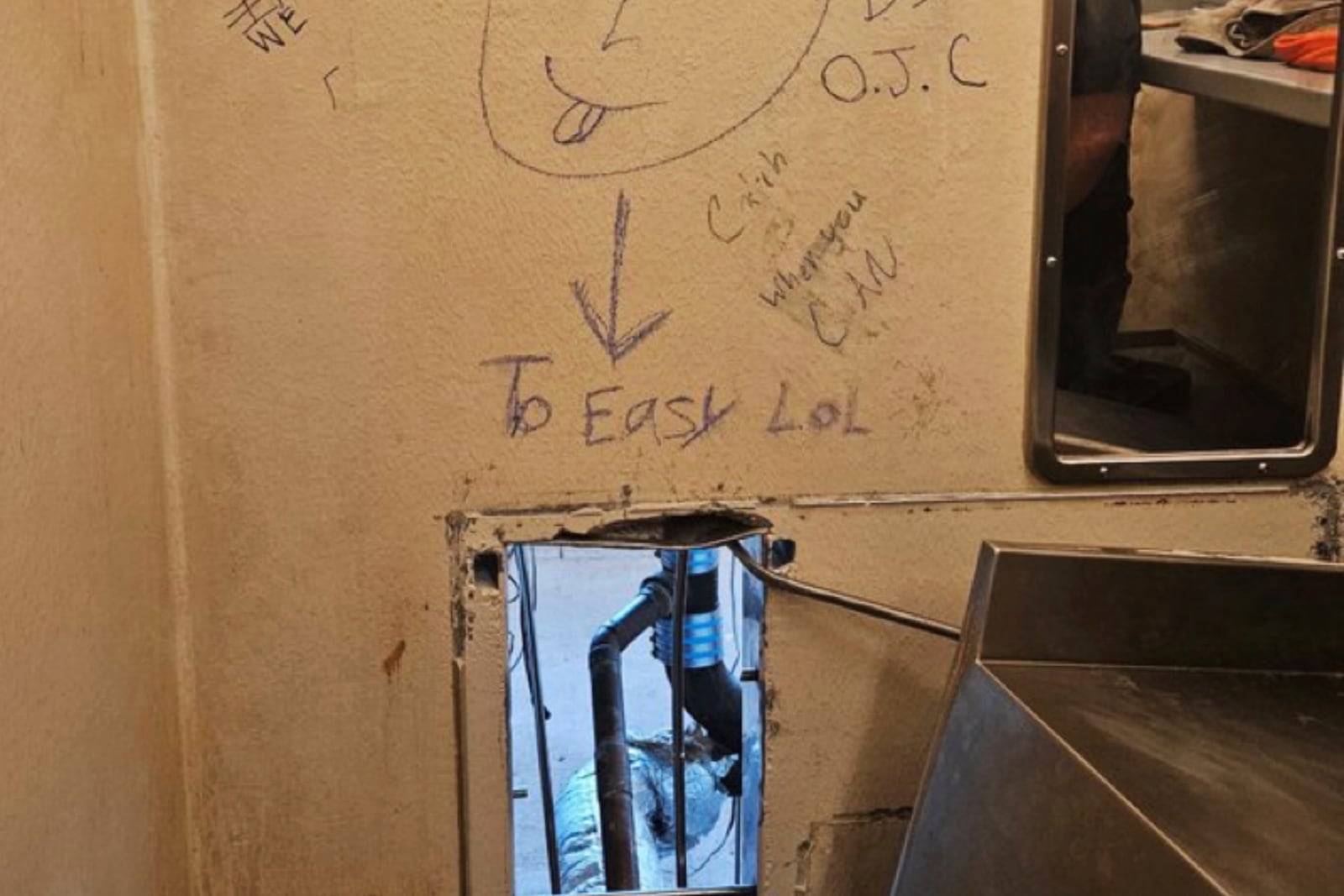 FILE - This photo obtained by The Associated Press on Friday, May 16, 2025, shows an opening inside a cell at the Orleans Justice Center in New Orleans. (AP Photo, File)