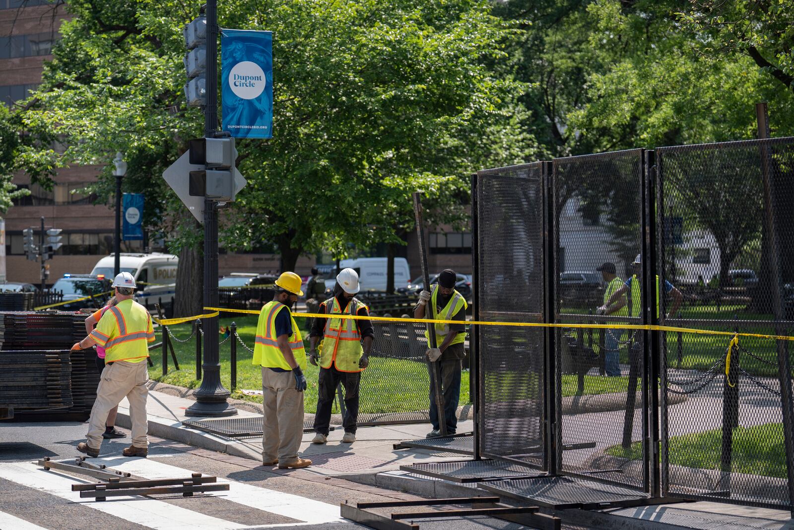 Workers put up fencing around Dupont Circle ahead of the World Pride Parade, Friday, June 6, 2025, in Washington. (AP Photo/Mark Schiefelbein)