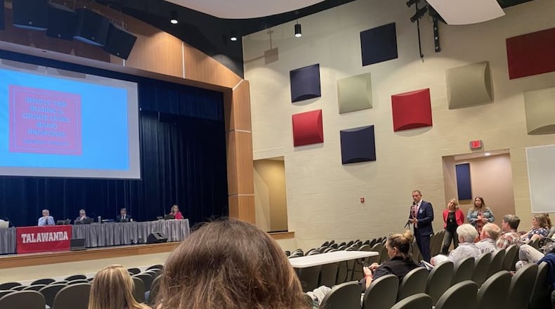Talawanda High School principal Scott Davie and assistant principal Rebekah Butz present a cost-cutting plan to the Talawanda School Board. ALEX LAVINE/OXFORD OBSERVER