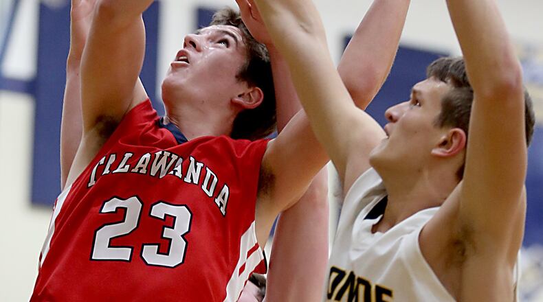 Talawanda’s Ty Hornsby has his shot blocked by Monroe guard Thryceton Deckard duing their game at Monroe on Dec. 27, 2016. COX MEDIA FILE PHOTO