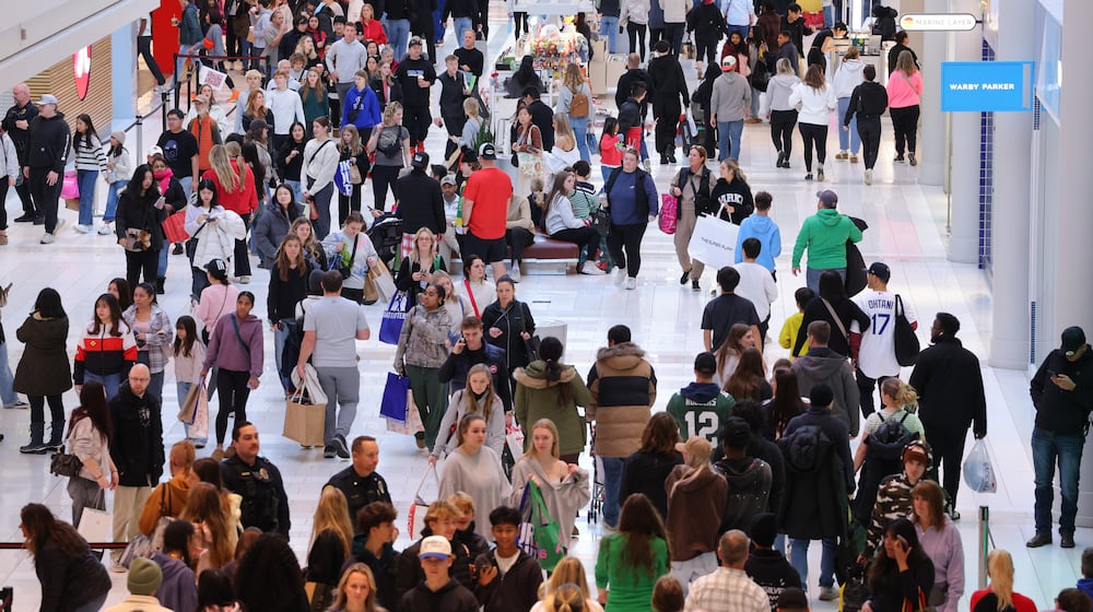 Shoppers browse through stores at Mall of America for Black Friday deals, Friday, Nov. 28, 2025, in Bloomington, Minn. (AP Photo/Adam Bettcher)